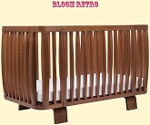 Нажмите для увеличения Использование кроватки Bloom Retro в цвете Oak для подросшего ребенка, который пытается вставать на ножки. Устанавливается на нижний уровень для обеспечения безопасности ребенка, чтобы не вылез через край кроватки. Фото: чуть сбоку