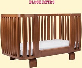 Нажмите для увеличения Вид кроватки с использованием Bloom Retro Bed Rail для преобразования кроватки Bloom Retro в цвете Oak в кушетку. Увеличивая срок использования кровати уже как кушетки для ребенка школьного возраста. Фото: чуть сбоку